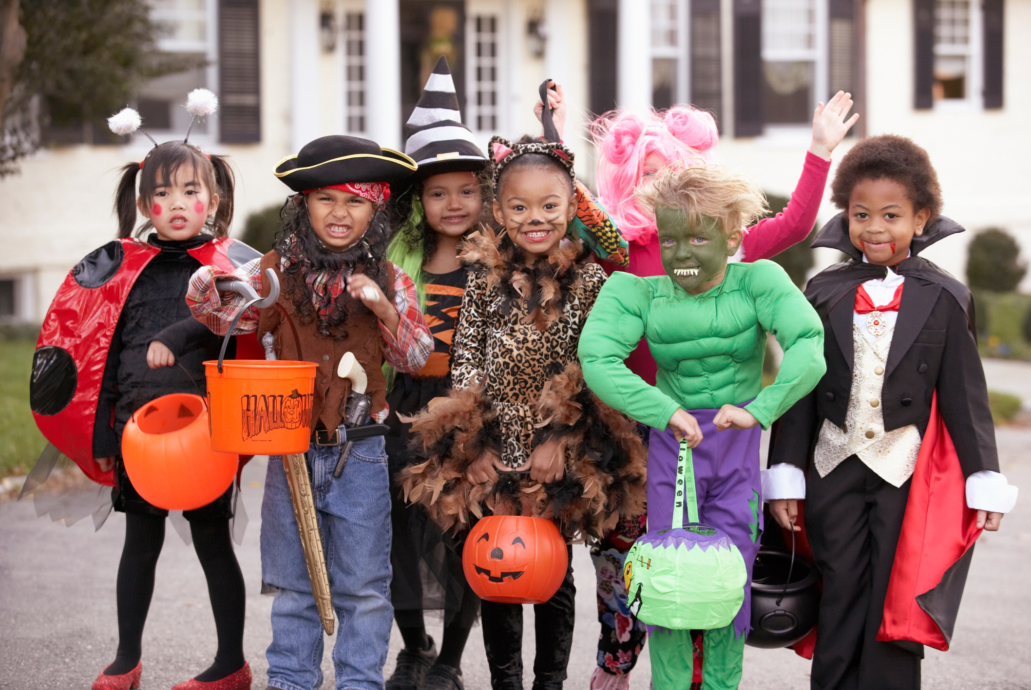 group of children dressed in Halloween costumes