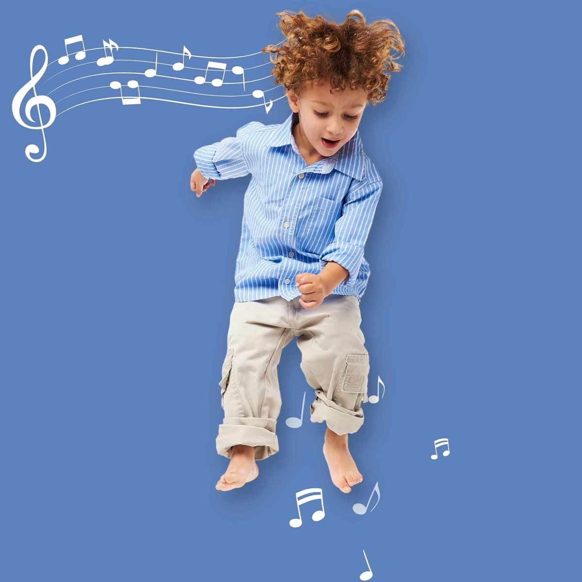 preschool child jumping with musical notes